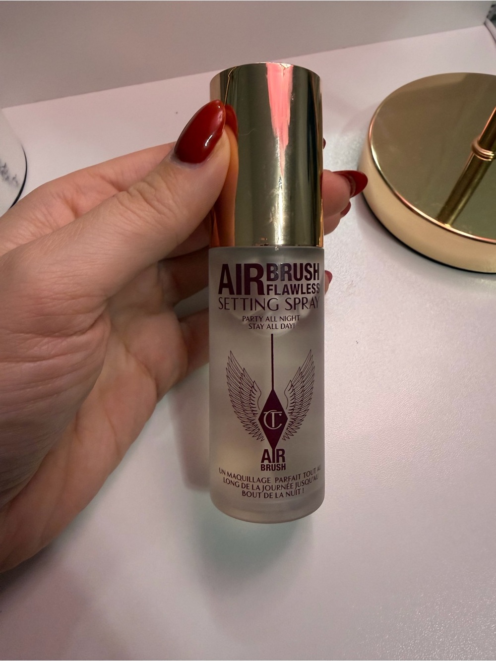Charlotte Tilbury Airbrush Flawless Setting Spray — Gold & Clear Bottle